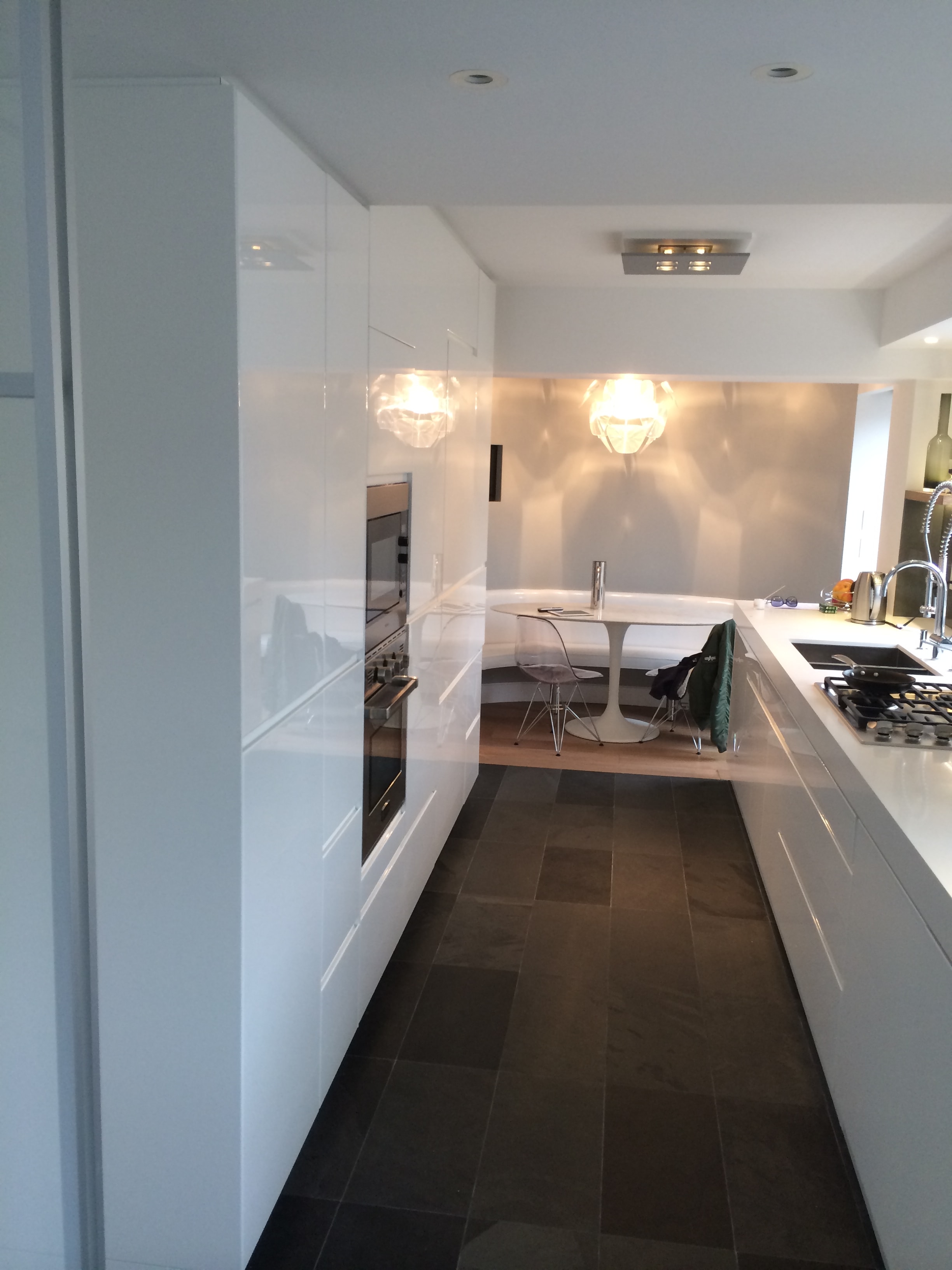Modern white kitchen with dining area