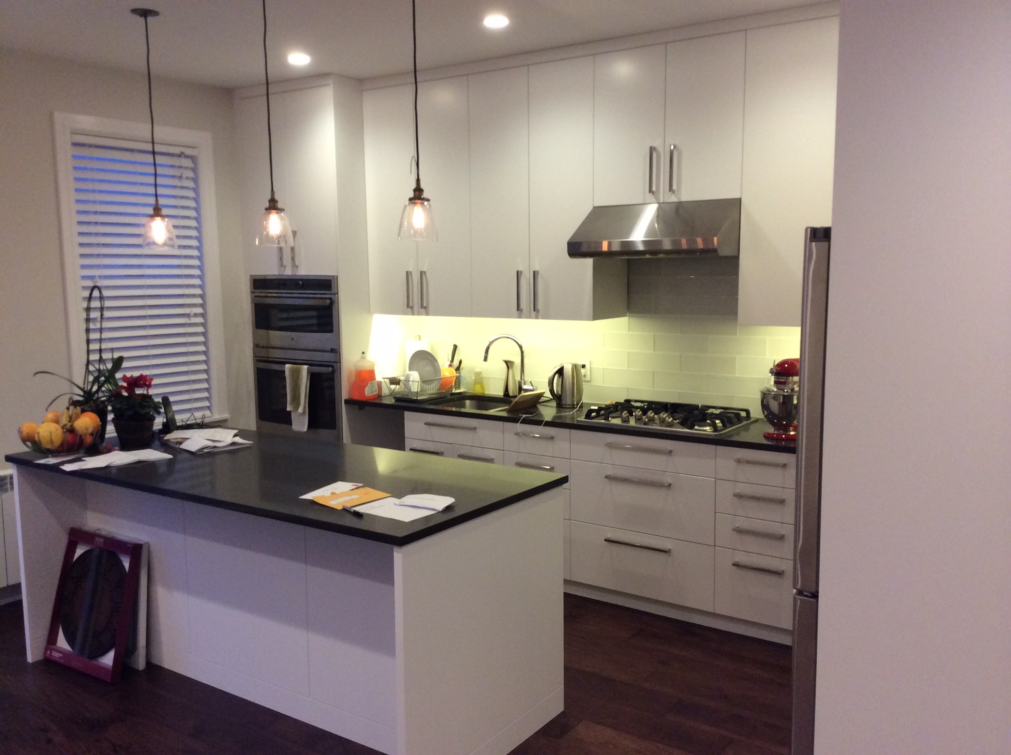 Modern kitchen with custom white cabinetry and island
